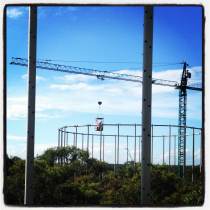 Researchers in a man bucket heading off to measure photosynthetic rates of canopy leaves